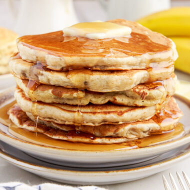 Stack of Banana Pancakes with butter on top and syrup