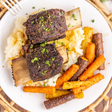 Overhead photo of two Beef Short Ribs over mashed potaoes