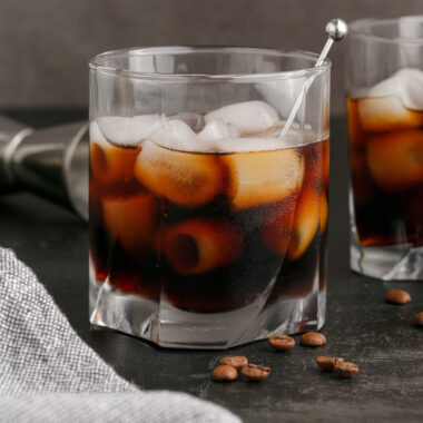 Black Russian in a rocks glass with another Black Russian behind it