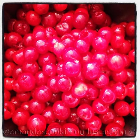 A close up photo of maraschino cherries.