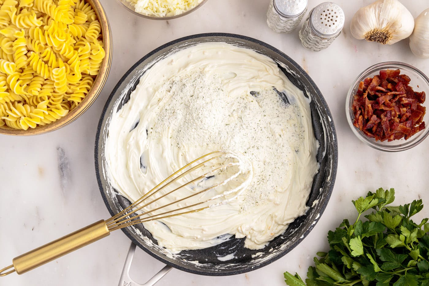 whisking ranch seasoning mix into cream cheese in a skillet