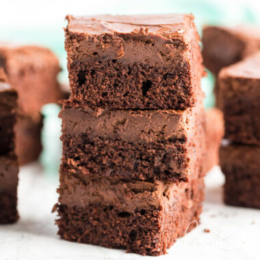 A stack of three Chocolate Cheesecake Brownies