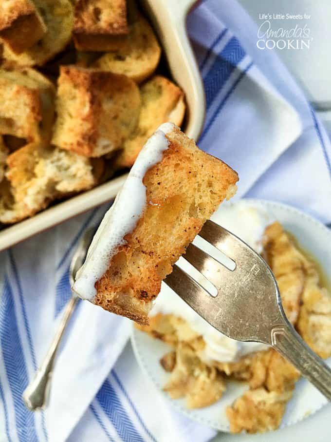 A piece of french toast casserole on a fork.