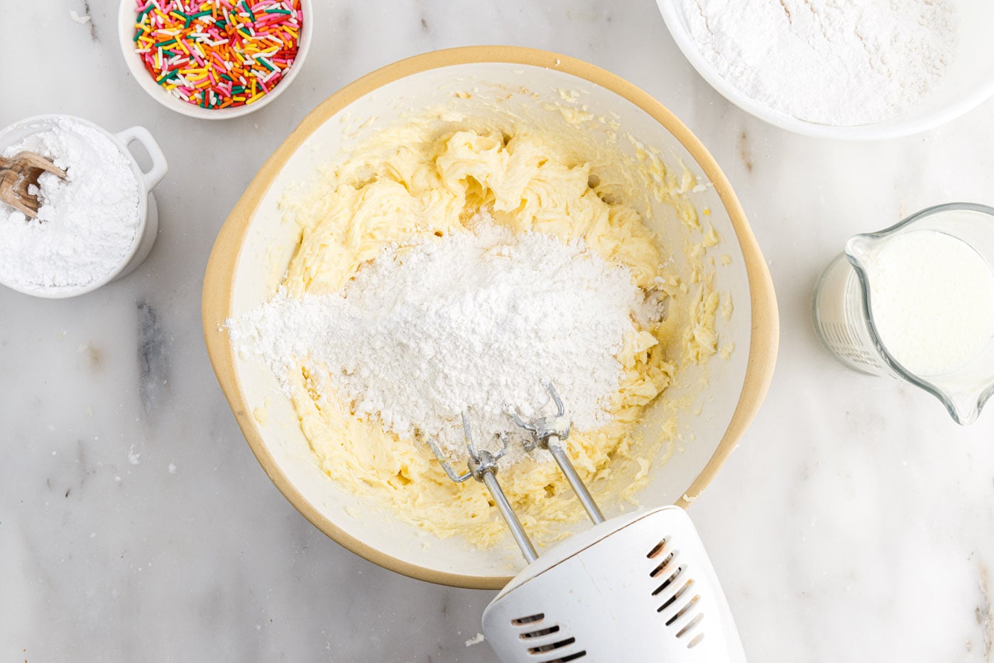 mixing flour mixture into butter mixture