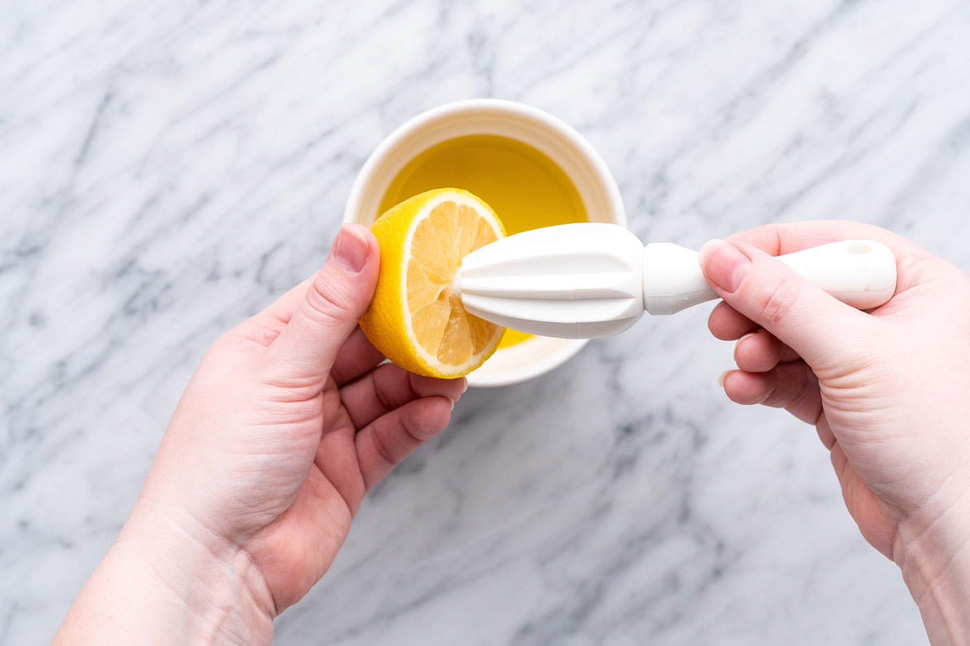 squeezing lemon juice out of lemon
