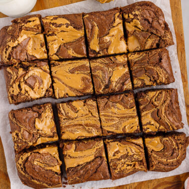 Peanut Butter Brownies cut up into squares on a wooden platter