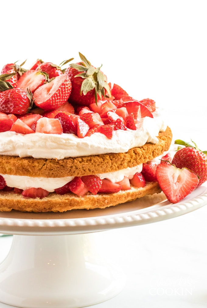 two layer strawberry shortcake on a cake plate